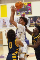 Lemoore's Kaleb Godeau looks to score in 53-42 loss to visiting Sunnyside High School Wednesday night.